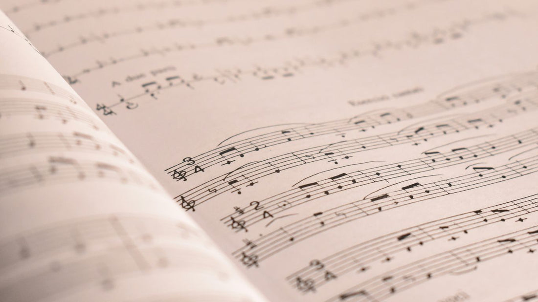 an open book with musical notes on it