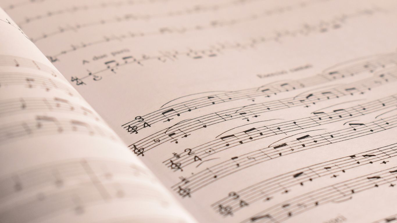 an open book with musical notes on it