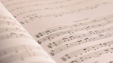 an open book with musical notes on it