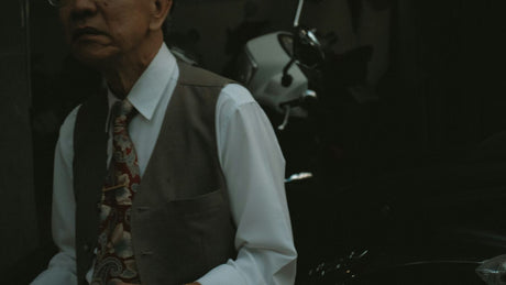 man in white dress shirt and gray necktie