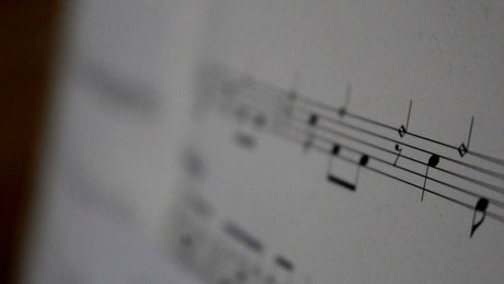 white musical notes on white paper
