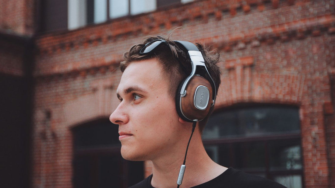 man using black and gray corded headphones