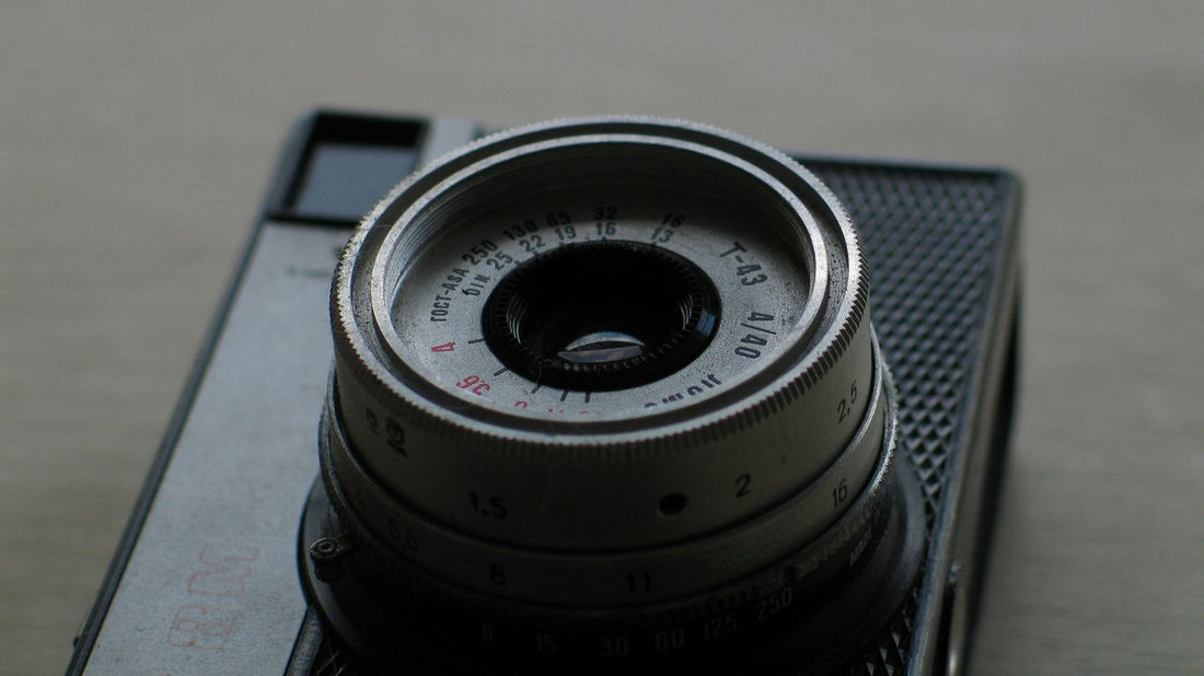 black camera lens on black surface