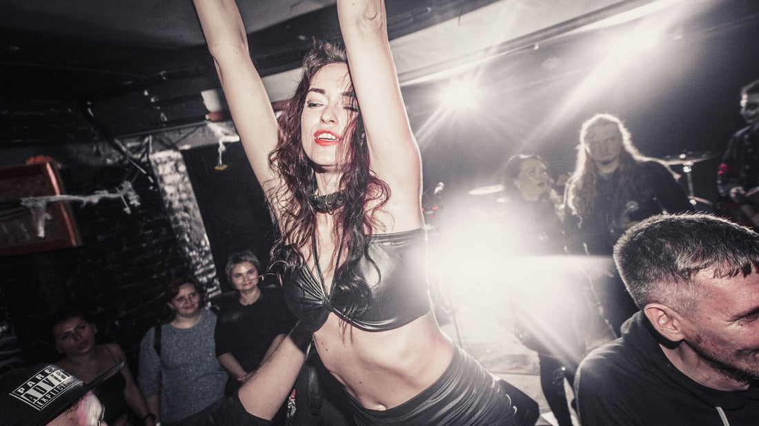 Woman dancing on shoulders at a concert