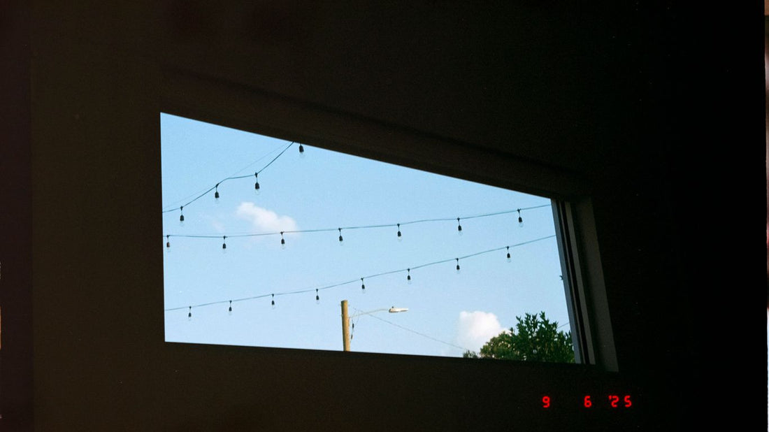 String lights against a bright blue sky